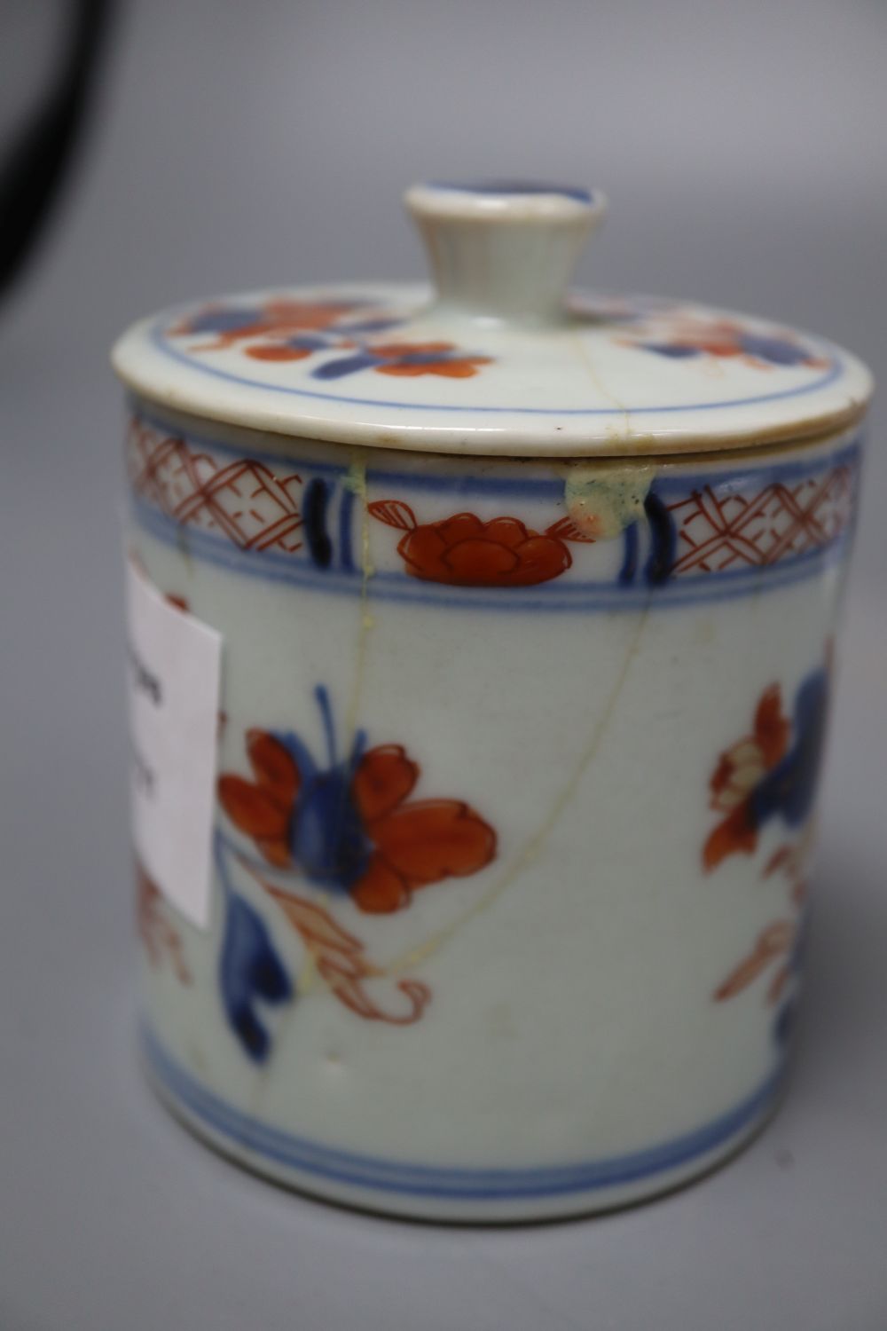 A Japanese blue and white dish, diameter 15cm, and a Chinese Imari jar box and cover